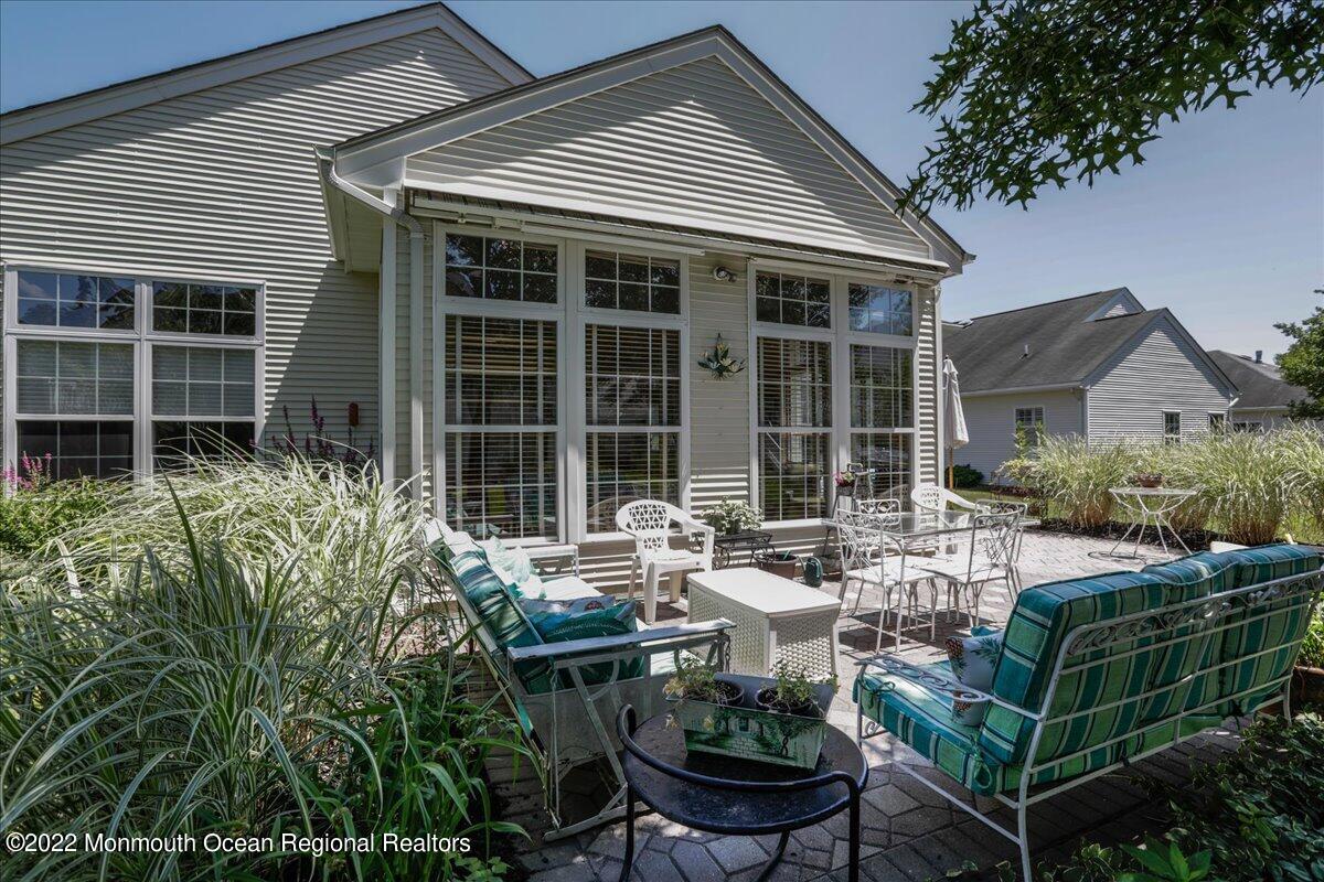 2513 Morningstar Road Manasquan, NJ 08736 - Photo 60 of 69 a front view of house with outdoor seating and green space