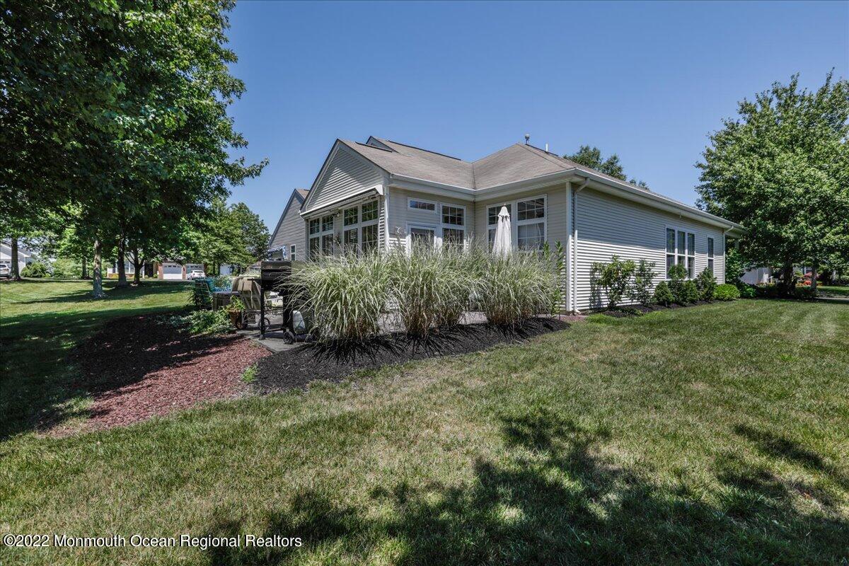 2513 Morningstar Road Manasquan, NJ 08736 - Photo 61 of 69 a front view of a house with garden