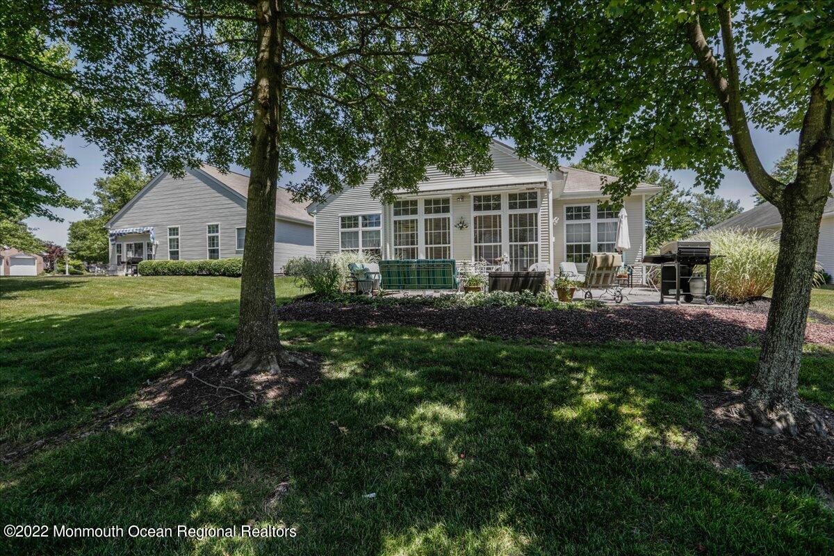 2513 Morningstar Road Manasquan, NJ 08736 - Photo 69 of 69 a view of a house with backyard sitting area and garden