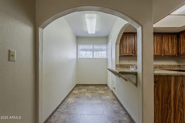 a large kitchen with a stove top oven