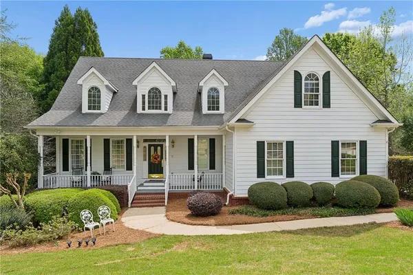 a outdoor living space with furniture and a large window