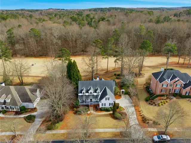 a view of a swimming pool with outdoor seating