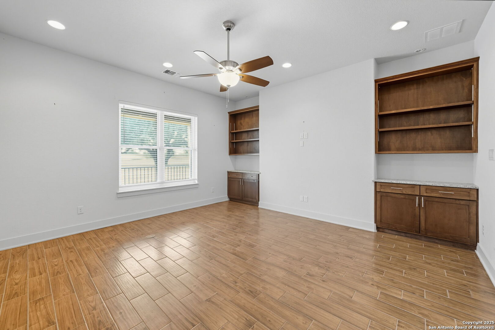 3172 Interstate 35 Natalia, TX 78059 - Photo 11 of 26 an empty room with wooden floor closet and windows