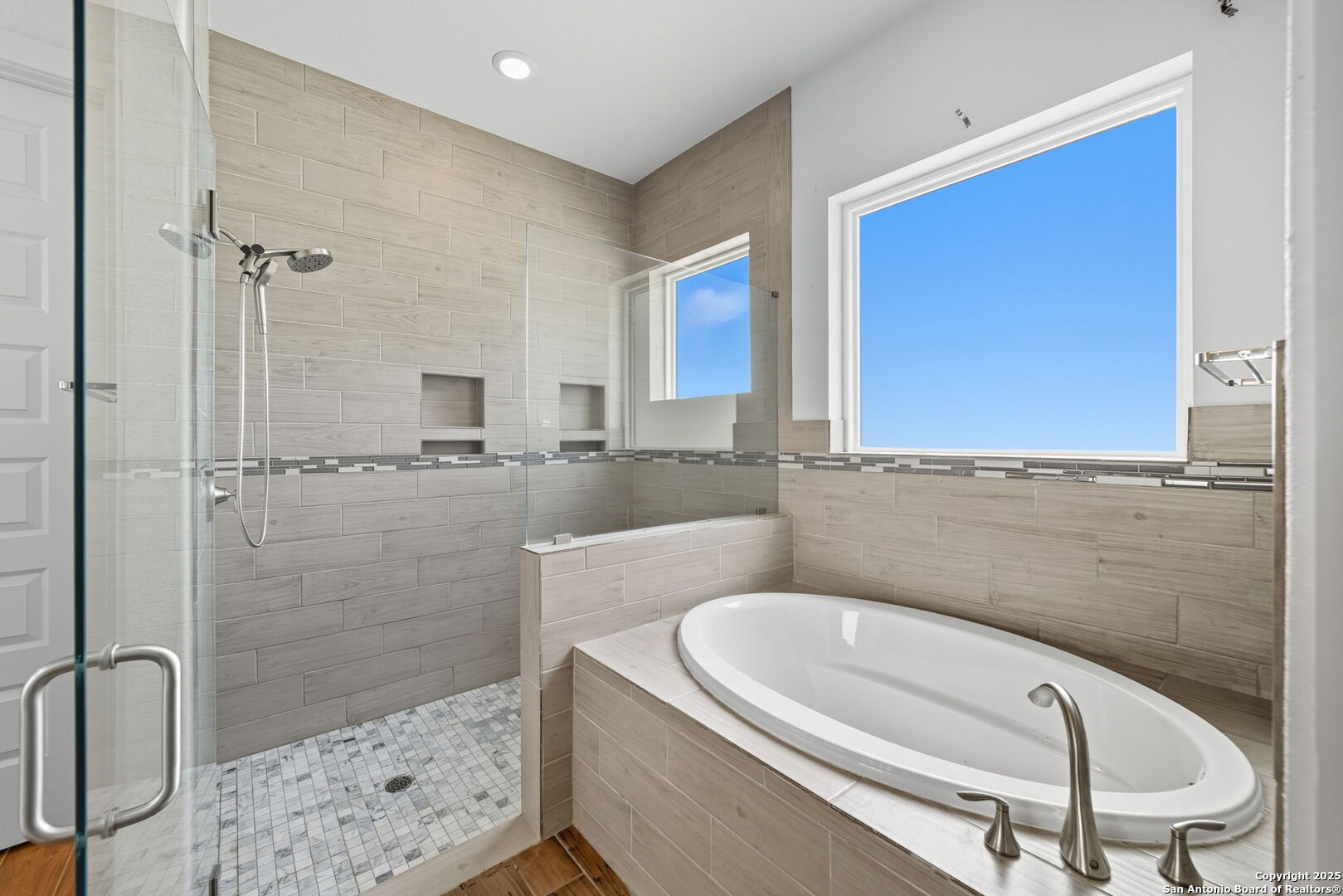 3172 Interstate 35 Natalia, TX 78059 - Photo 15 of 26 a bathroom with a tub a sink and a mirror