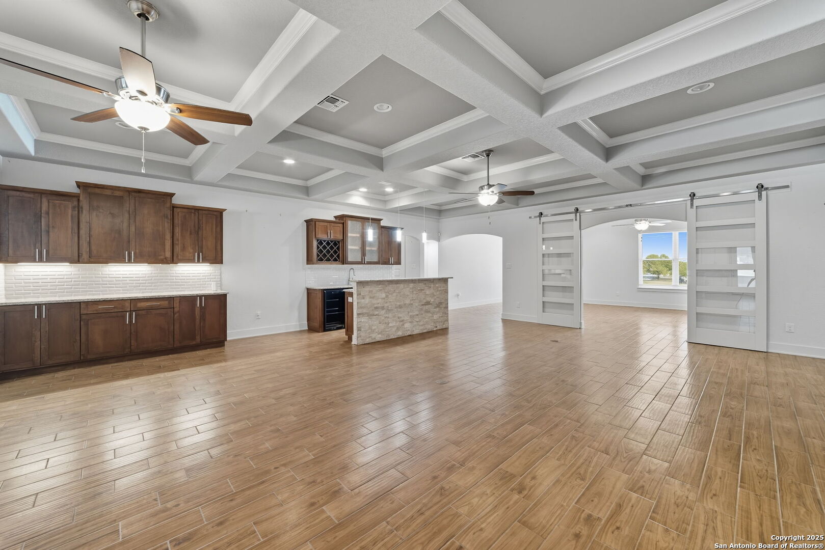 3172 Interstate 35 Natalia, TX 78059 - Photo 5 of 26 a view of an empty room with a window and kitchen view