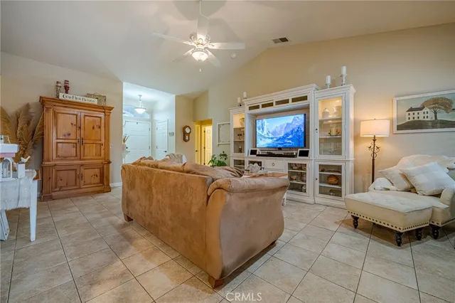 a view of a room with wooden floor and a window