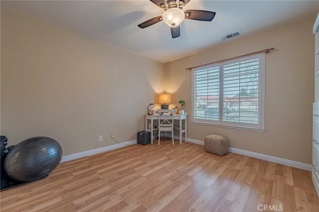 a bedroom with a bed and a table in it