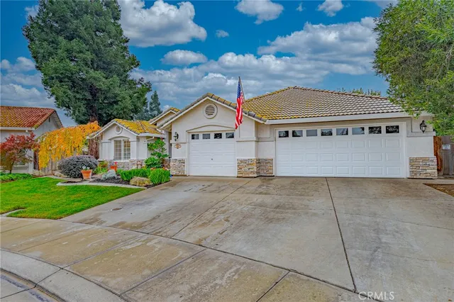 a front view of a house with garage