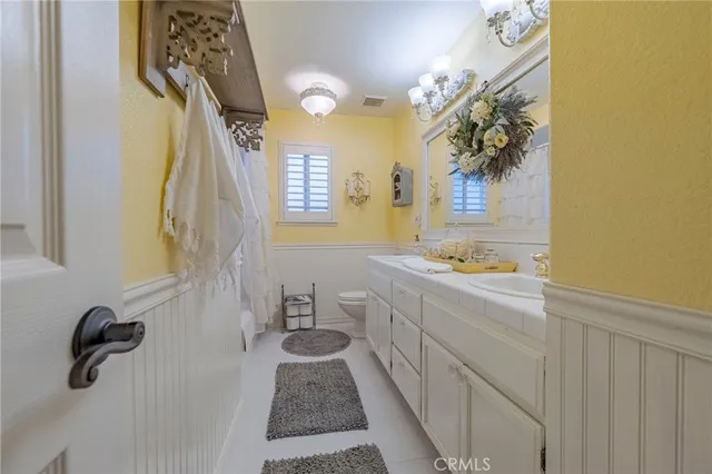 a bedroom with a bed and ceiling fan