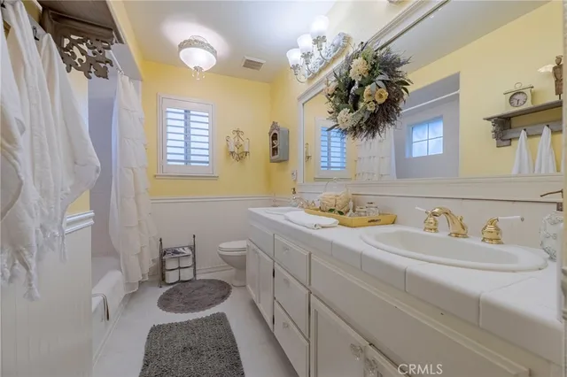 a bedroom with a bed and cabinets