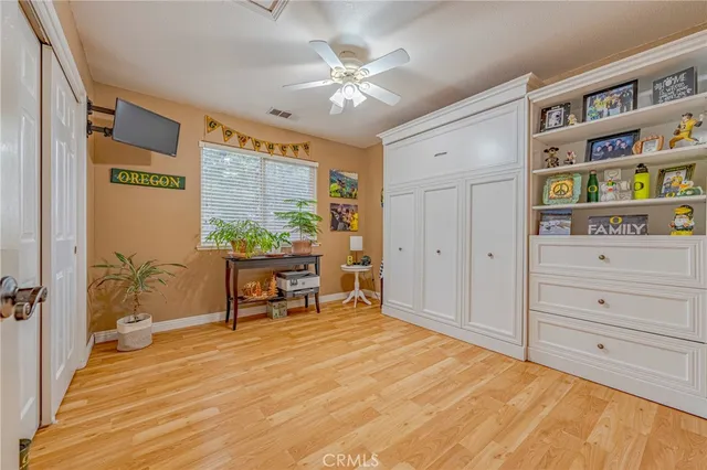 a bathroom with a granite countertop shower a sink and a mirror