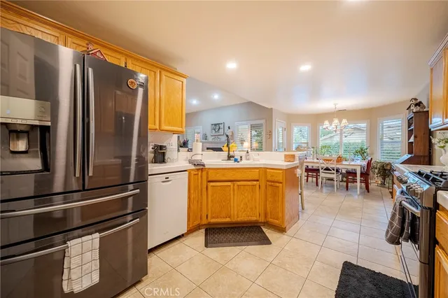 a kitchen with stainless steel appliances a stove microwave and sink