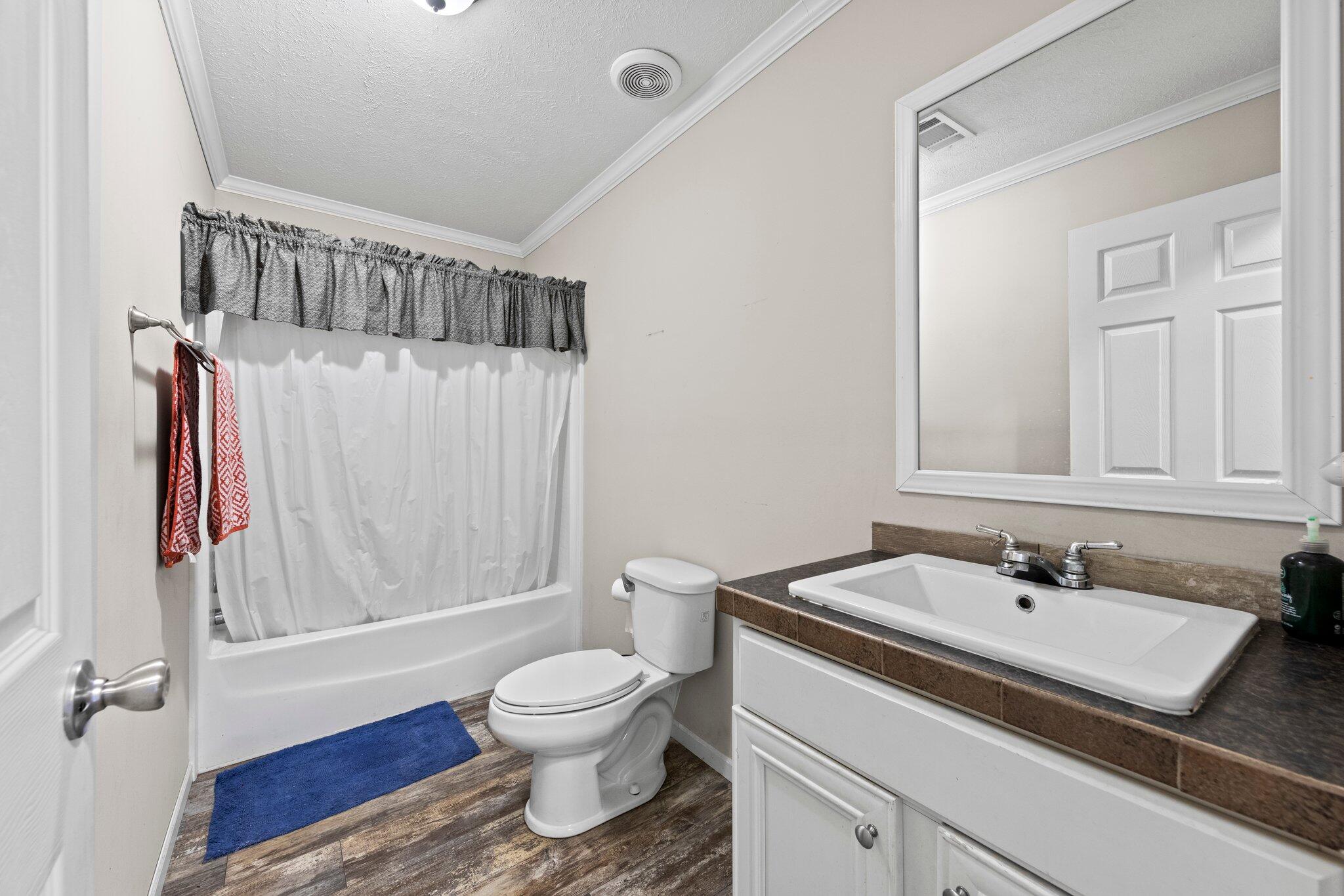 830 Squirrel Road DeFuniak Springs, FL 32433 - Photo 20 of 30 a bathroom with a sink toilet and shower