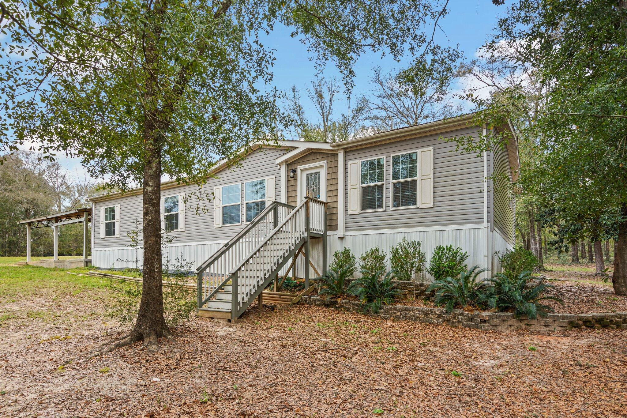 830 Squirrel Road DeFuniak Springs, FL 32433 - Photo 3 of 30 a view of a house with a yard