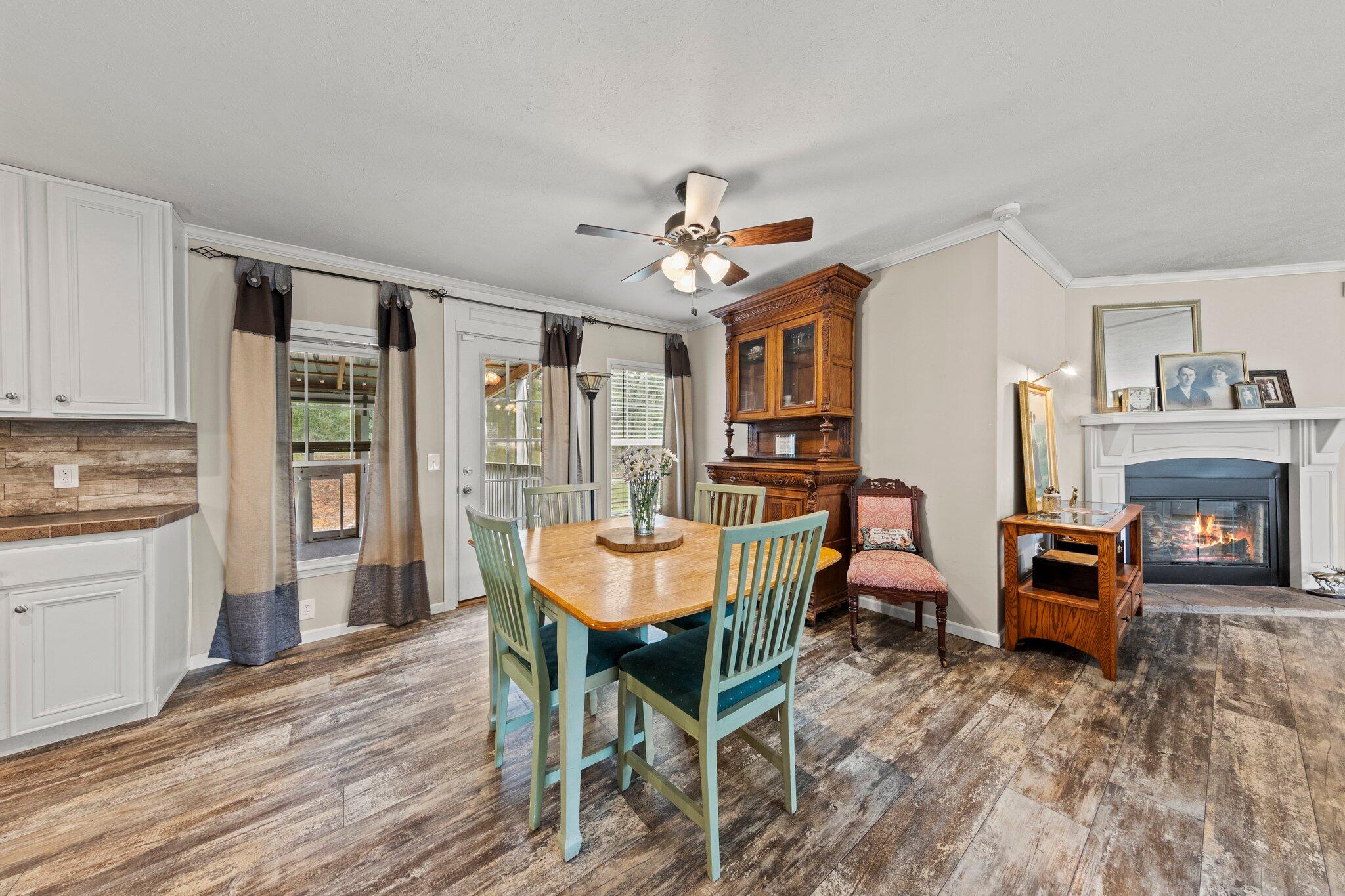 830 Squirrel Road DeFuniak Springs, FL 32433 - Photo 9 of 30 a dining room with furniture window and wooden floor