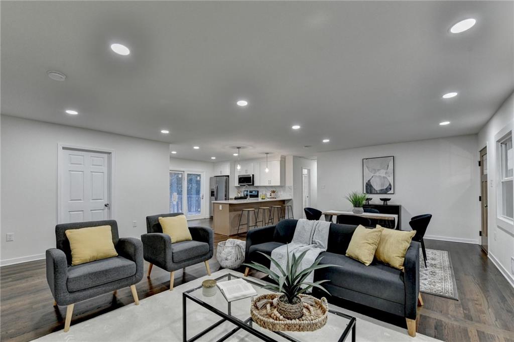 2137 Plantation Lane Chamblee, GA 30341 - Photo 11 of 54 a living room with furniture and a wooden floor