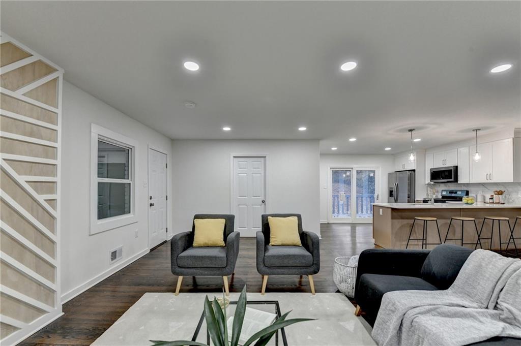 2137 Plantation Lane Chamblee, GA 30341 - Photo 13 of 54 a living room with furniture and a view of kitchen