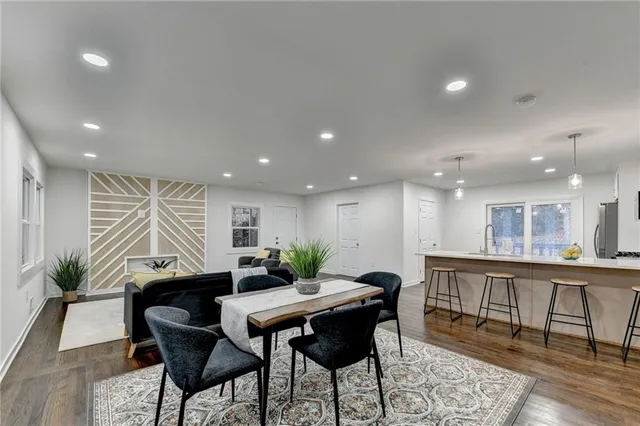 a kitchen with a table and chairs in it