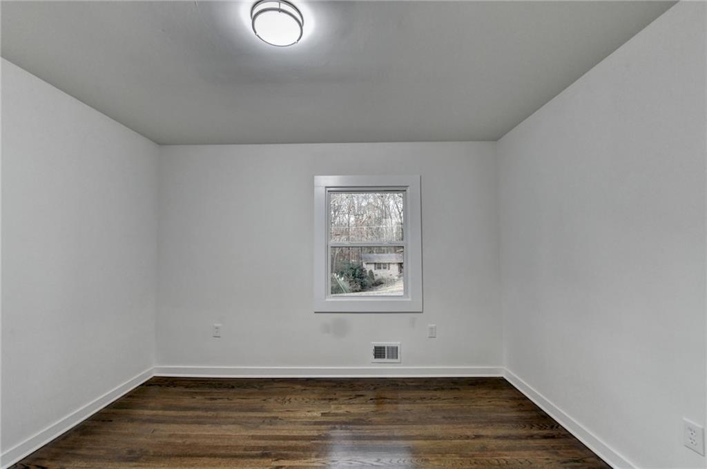 2137 Plantation Lane Chamblee, GA 30341 - Photo 31 of 54 a view of a room with wooden floor and window