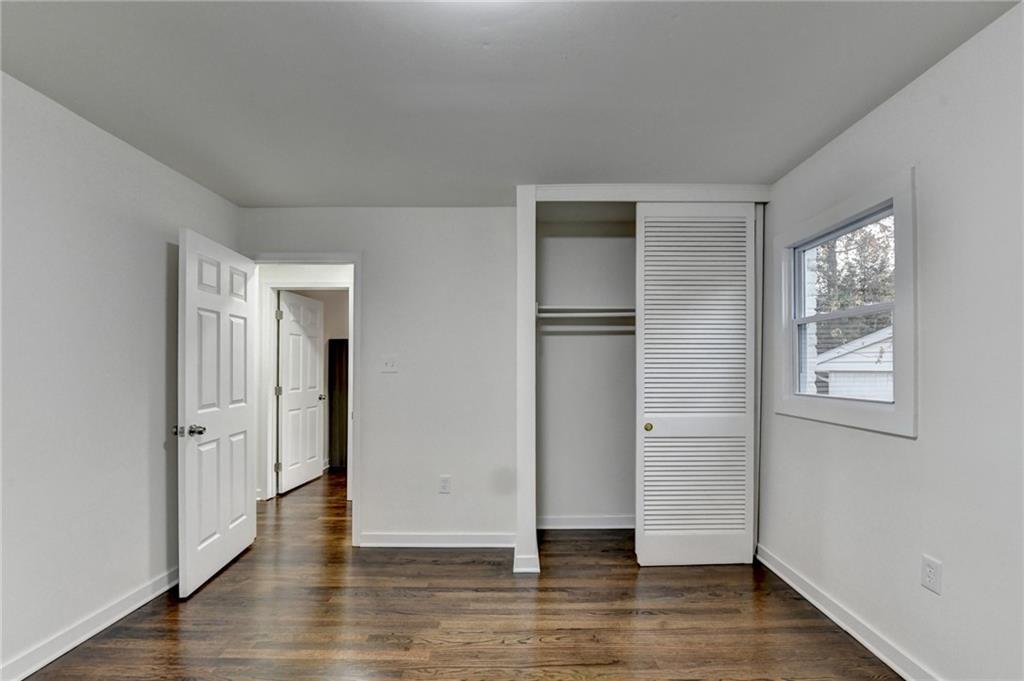2137 Plantation Lane Chamblee, GA 30341 - Photo 32 of 54 an empty room with wooden floor and windows