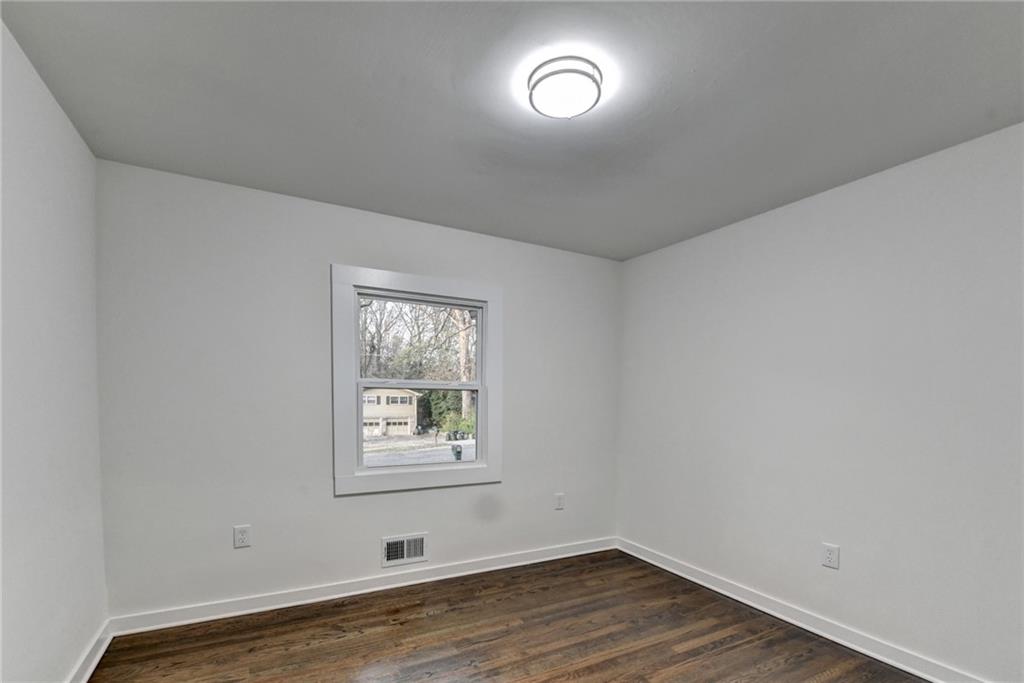 2137 Plantation Lane Chamblee, GA 30341 - Photo 35 of 54 wooden floor in an empty room with a window