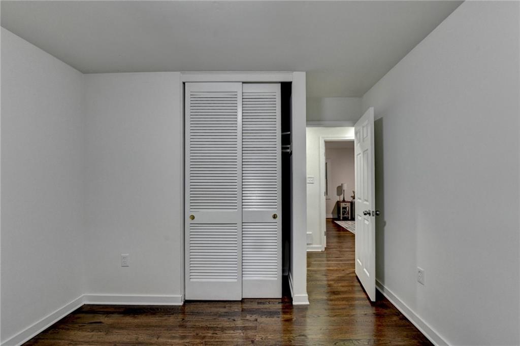 2137 Plantation Lane Chamblee, GA 30341 - Photo 37 of 54 wooden floor in a hall with an empty room