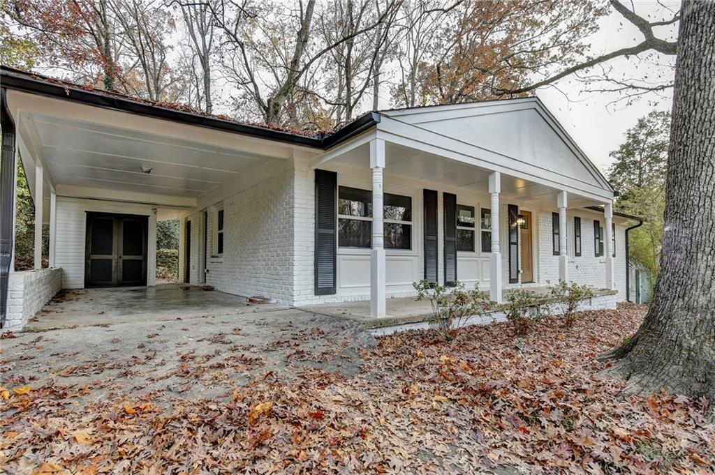 2137 Plantation Lane Chamblee, GA 30341 - Photo 4 of 54 a front view of a house with garden