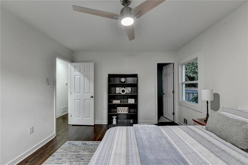 2137 Plantation Lane Chamblee, GA 30341 - Photo 42 of 54 a bedroom with a large bed and a chandelier