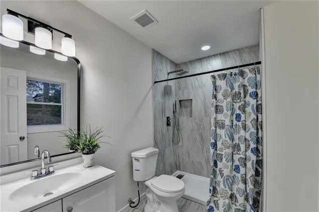 a view of backyard with a deck and wooden floor