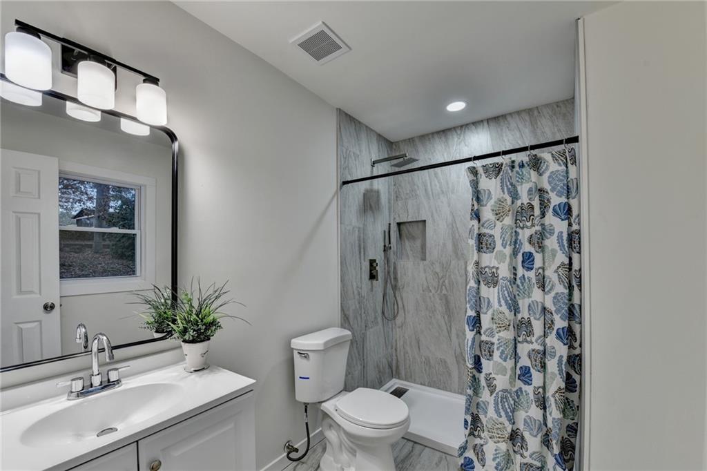 2137 Plantation Lane Chamblee, GA 30341 - Photo 45 of 54 a bathroom with a sink toilet and shower