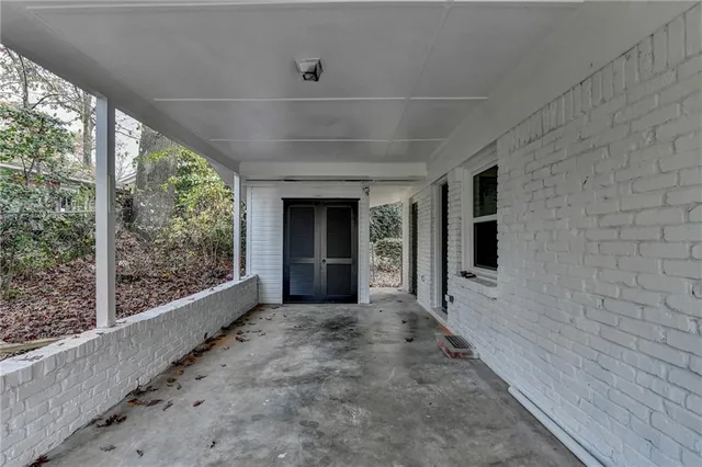 front view of a house with a large trees