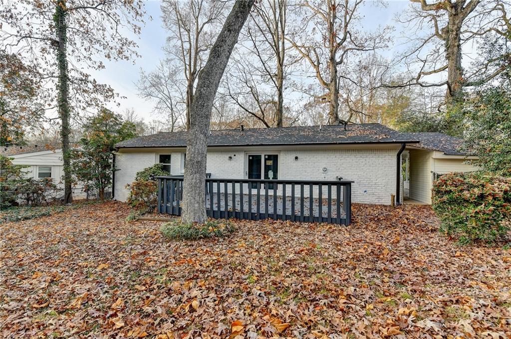 2137 Plantation Lane Chamblee, GA 30341 - Photo 50 of 54 front view of a house with a large trees