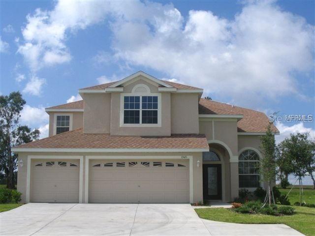 13421 Sydney Road Valrico, FL 33594 - Photo 1 of 1 a front view of a house with a garden