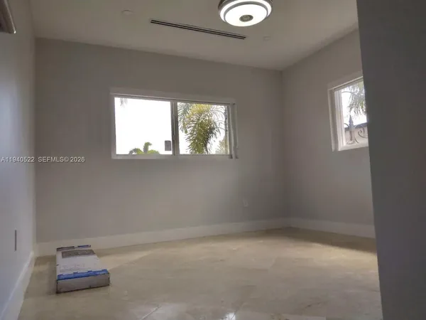 a white bath tub sitting next to a white toilet and sink