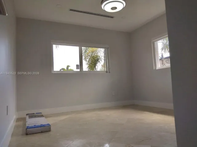 a white bath tub sitting next to a white toilet and sink
