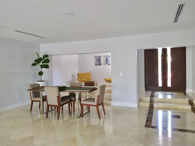 a bathroom with a double vanity sink toilet and shower