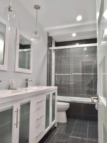 a view of a backyard with sitting area