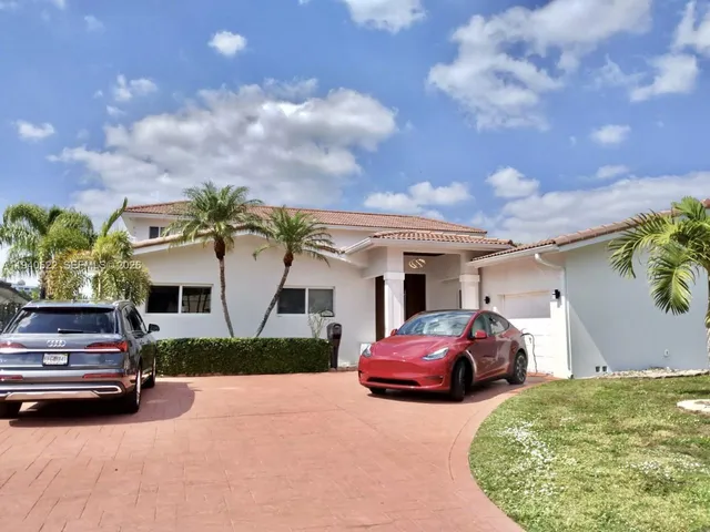a bedroom with a bed window and a dresser