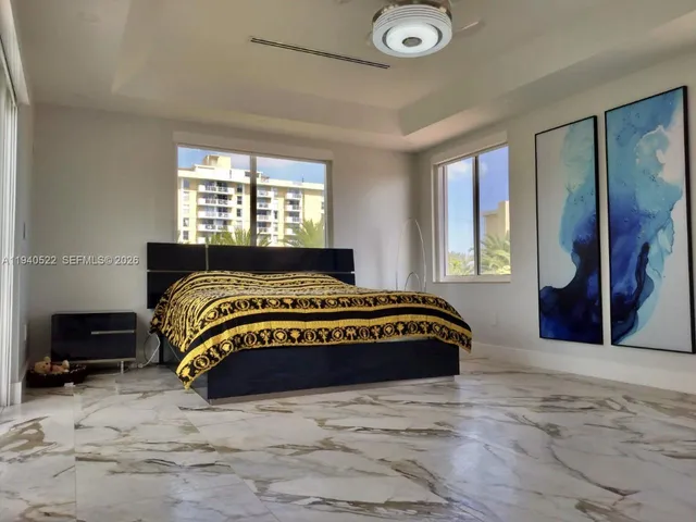 a view of a livingroom with wooden floor and staircase
