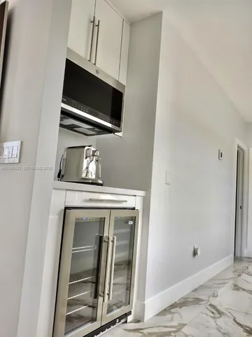 a spacious bathroom with a double vanity sink and a mirror