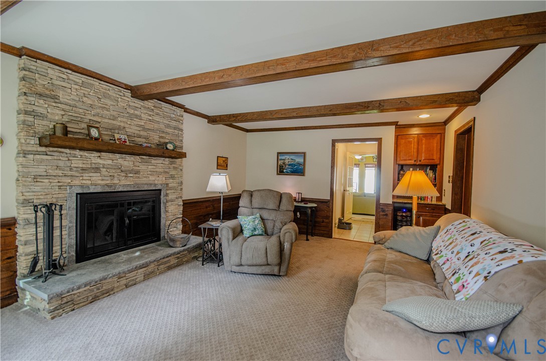 12500 Musical Lane Midlothian, VA 23113 - Photo 9 of 51 Living area featuring a stone-clad fireplace with
