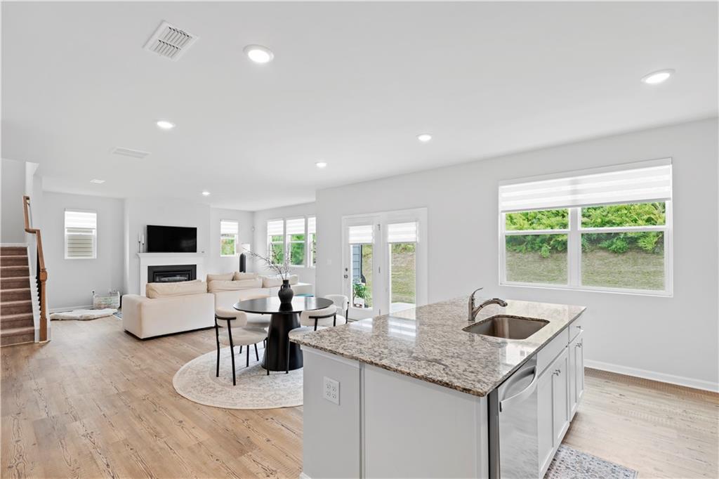 4780 Mock Orange Street Atlanta, GA 30331 - Photo 24 of 47 a kitchen with stainless steel appliances granite countertop a sink and a large window