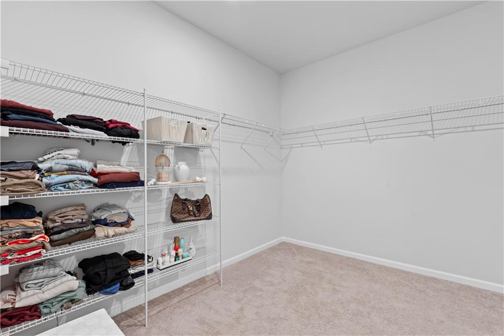 4780 Mock Orange Street Atlanta, GA 30331 - Photo 33 of 47 a view of walk in closet with clothes and shoes