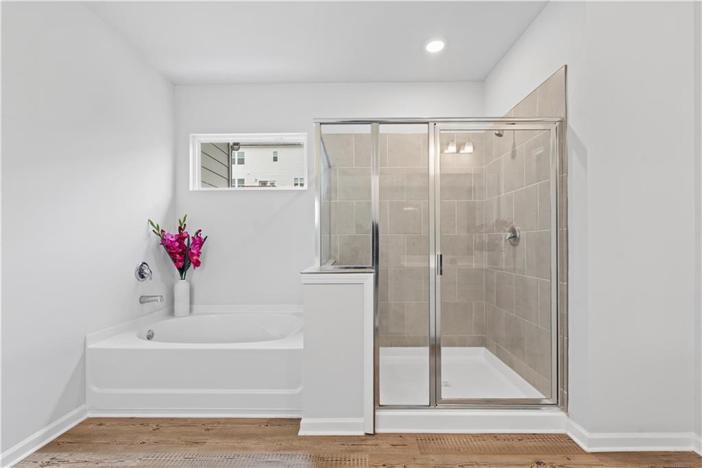 4780 Mock Orange Street Atlanta, GA 30331 - Photo 35 of 47 a bathroom with a bathtub and a shower