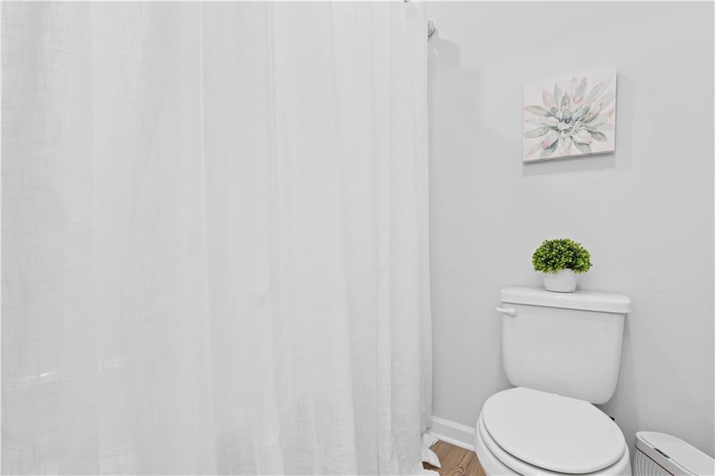 4780 Mock Orange Street Atlanta, GA 30331 - Photo 39 of 47 a white toilet sitting next to a white walls