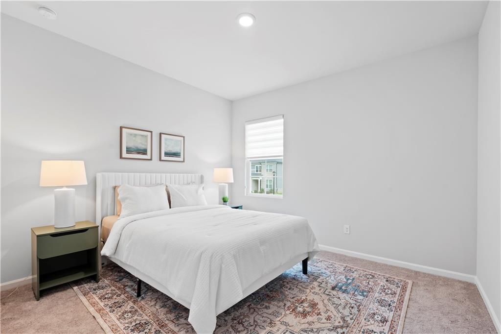4780 Mock Orange Street Atlanta, GA 30331 - Photo 40 of 47 a bedroom with a bed and a lamp