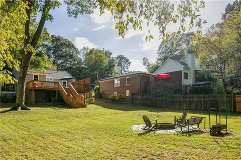 a view of a park with large trees