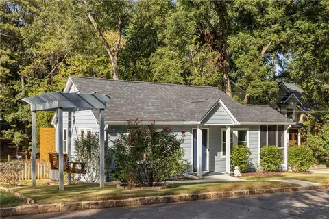 front view of a house with a garden