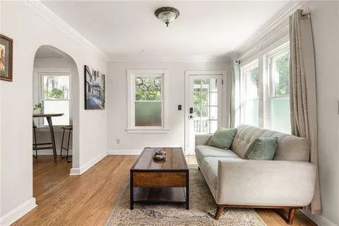 a living room with furniture and a window