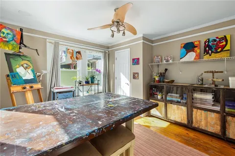 a living room with kitchen island furniture and a kitchen view
